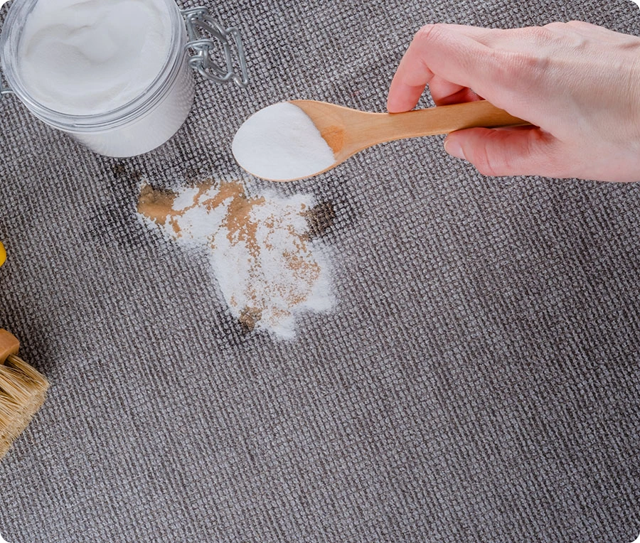 Using baking soda paste for stain removal on clothing