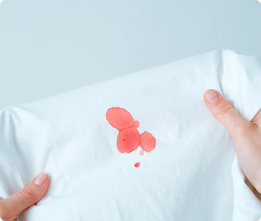 Cleaning blood stains from clothes using cold water and liquid detergent